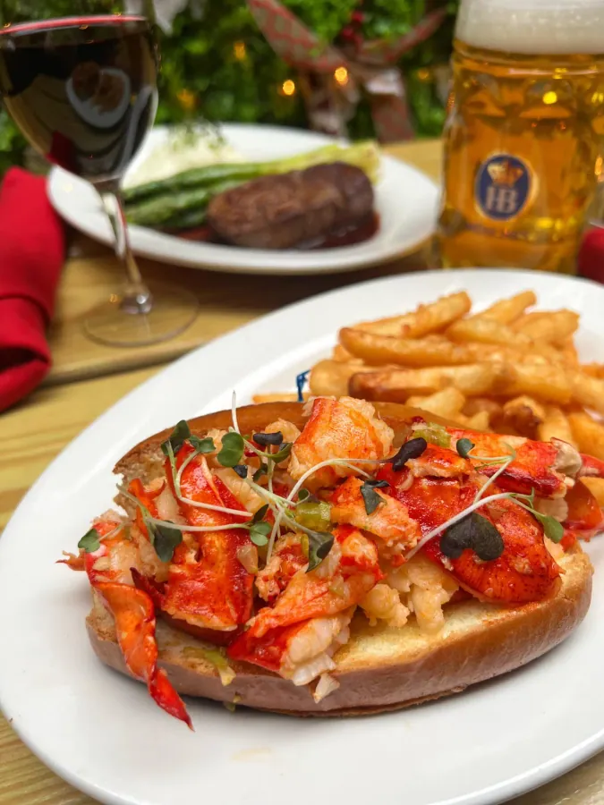 Lobster roll with fries and a beer