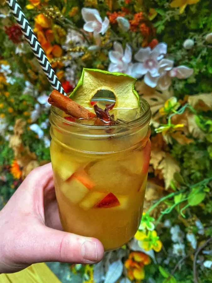Pumpkin pie sangria in a mason jar with a cinnamon stick