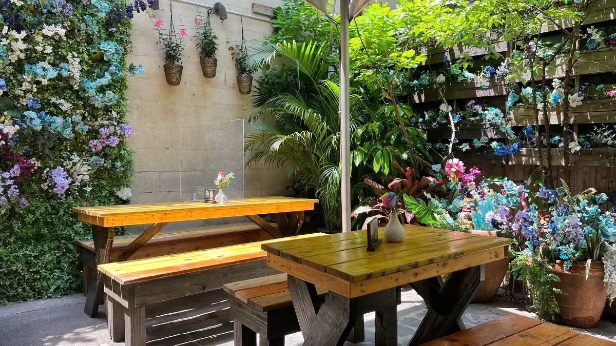 A garden party at Loreley Beer Garden, long tables under the trees