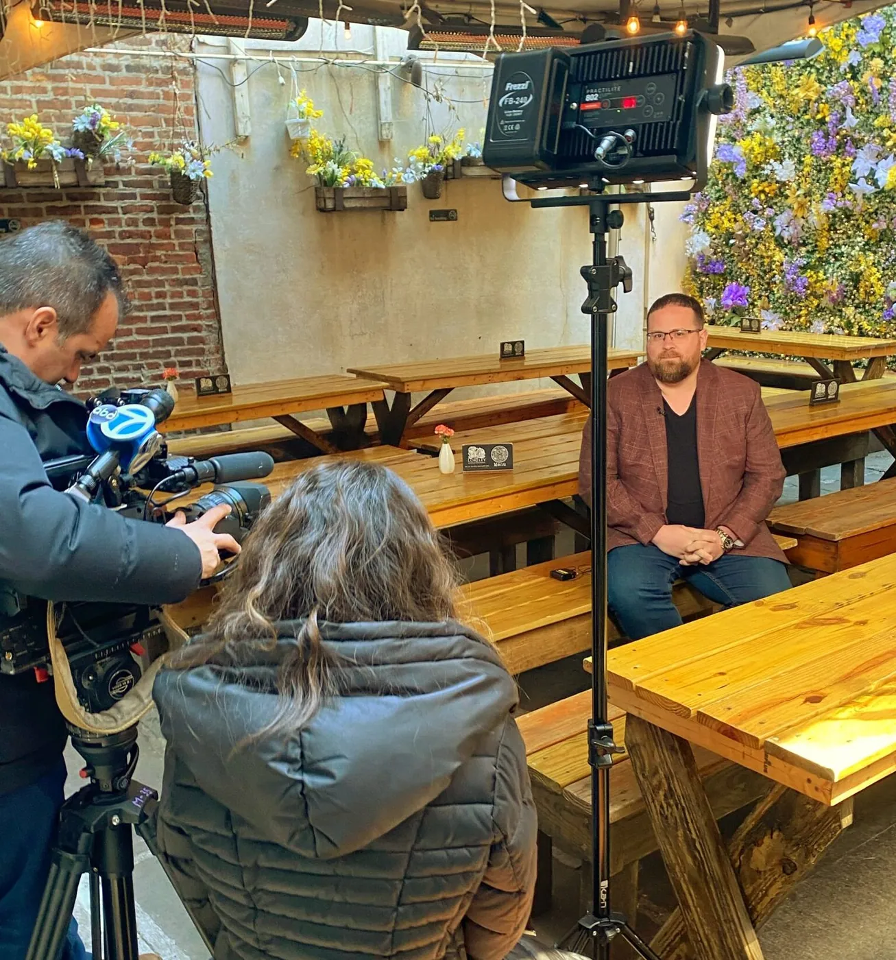 The founder of ION Hospitality being filmed at his restaurant