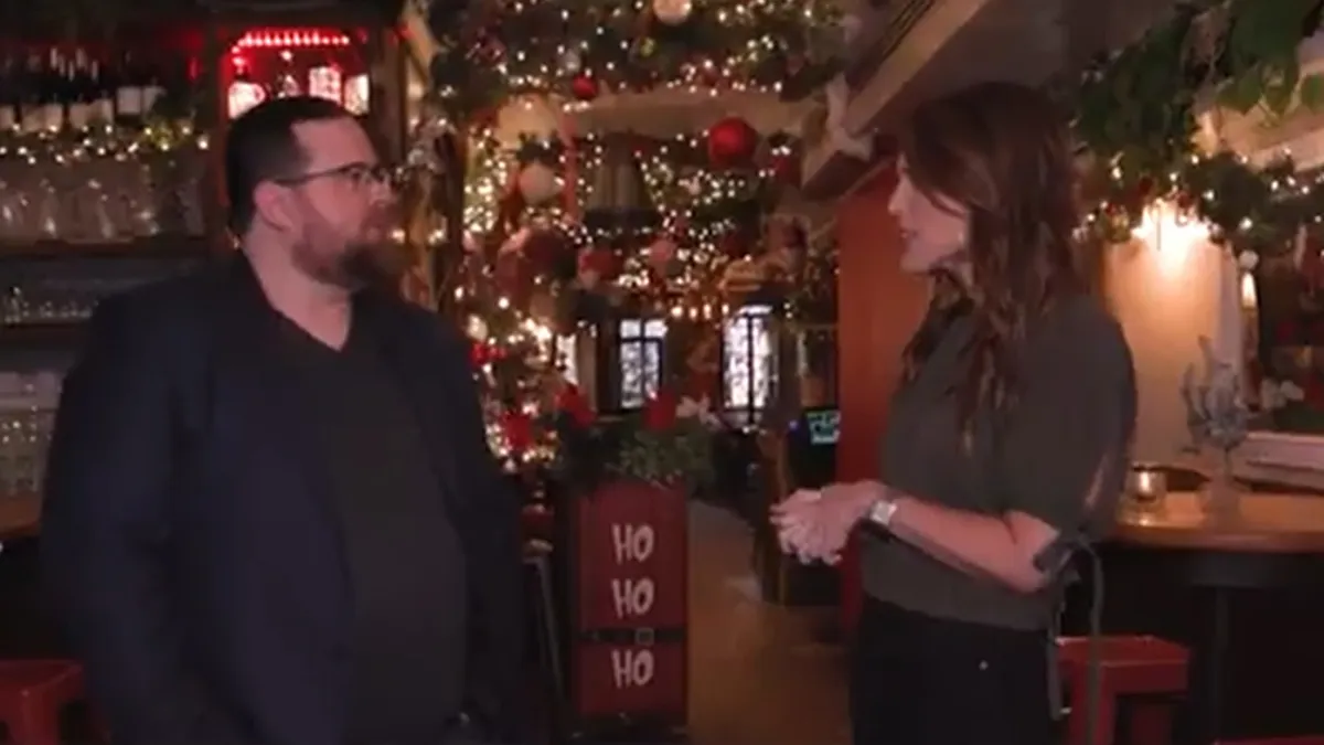 Doug Jacobson with Lauren Scala on NBC New York Live, at Loreley Beer Garden decorated for Christmas