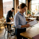 Restaurant manager reviewing event booking details