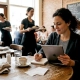 Restaurant owner manages digital marketing at table