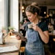 Restaurant owner checking website by window