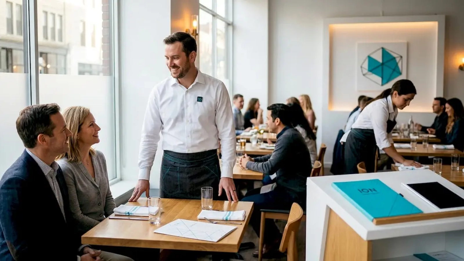 Restaurant manager greets returning customers
