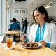Customer using phone to order at restaurant