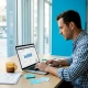 Restaurant owner reviewing marketing dashboard at table