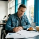 Restaurant owner reviewing marketing plans