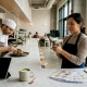 Restaurant owner filming kitchen video content