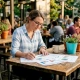 Woman reviewing restaurant engagement metrics charts