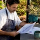 Restaurant owner reviewing marketing strategy at table