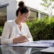 Woman planning restaurant radio ad scripts