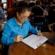 Restaurant manager reviewing appliance alternatives list