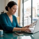 Restaurant owner typing catering inquiry response