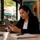 Restaurant owner checking online reviews on tablet