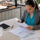 Restaurant manager reviewing sales reports