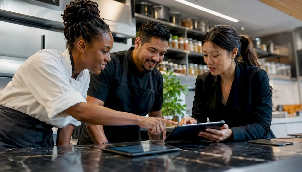 Restaurant team collaborating over review feedback