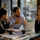 Restaurant managers discussing marketing campaign