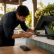 Person wiring restaurant POS device