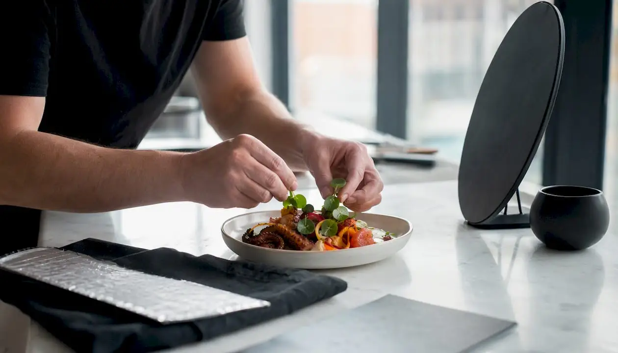 Hands styling dish for food photography