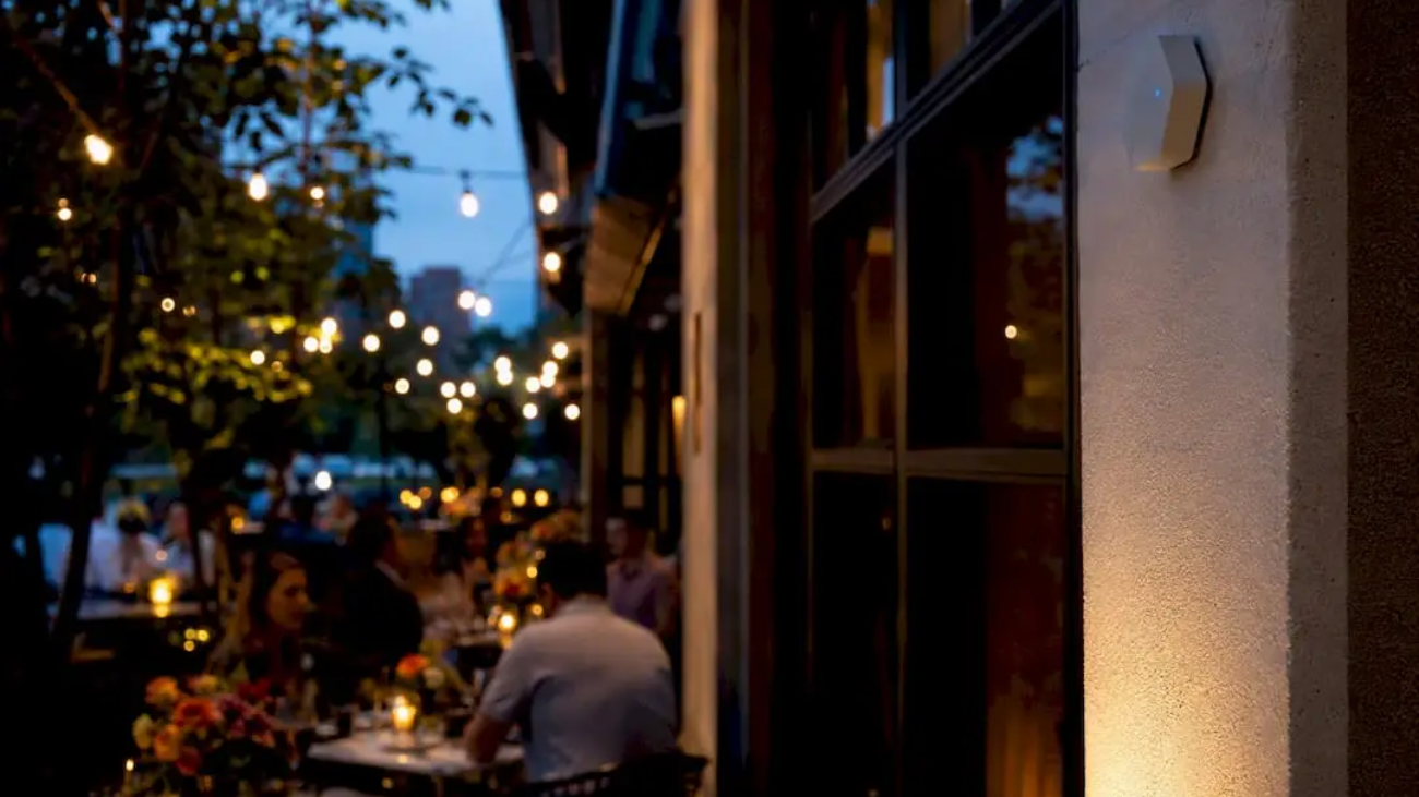 Outdoor beacon device on restaurant exterior