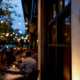 Outdoor beacon device on restaurant exterior